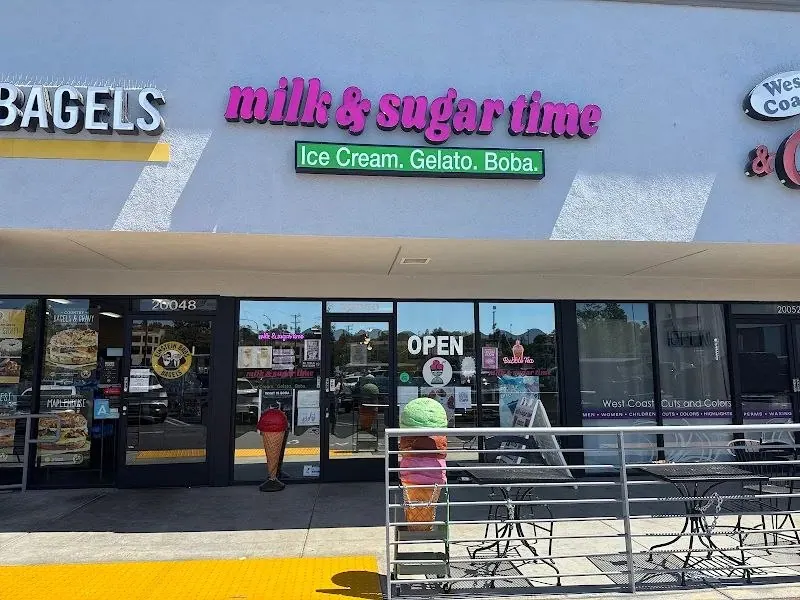 Milk & Sugar Time storefront with patio seating