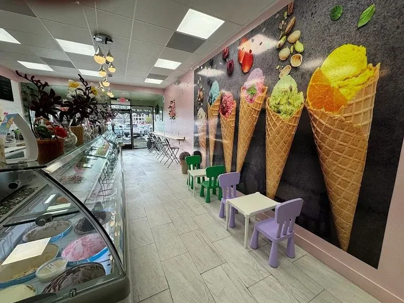 Shop interior with ice cream cone wall art and kids seating