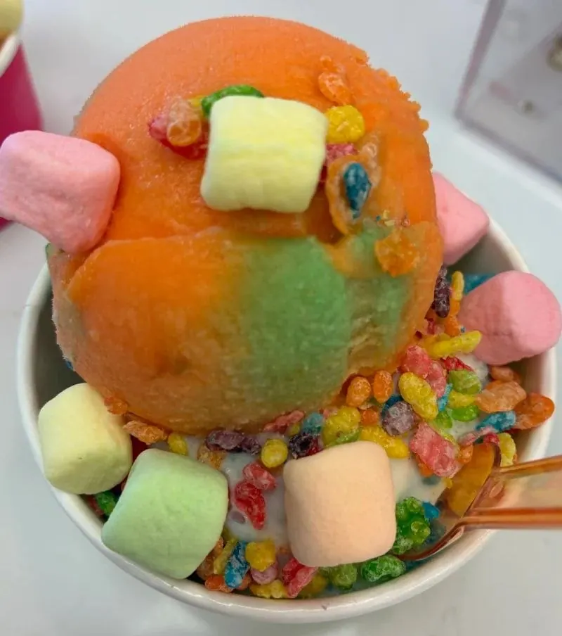 Ice cream topped with marshmallows and cereal