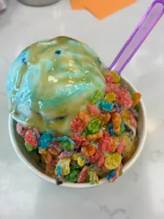 Ice cream with cereal and blue drizzle