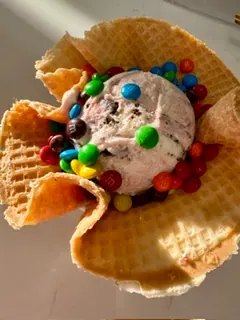 Ice cream with M&Ms in a waffle bowl