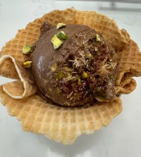 Chocolate pistachio gelato in a waffle bowl