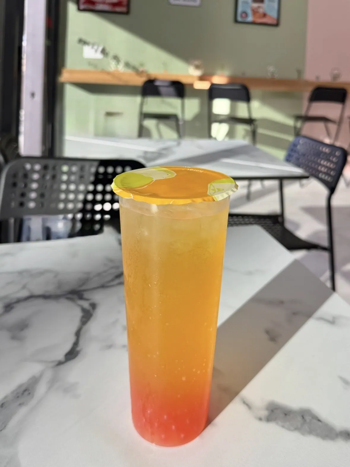 Mango flavored green tea with popping boba